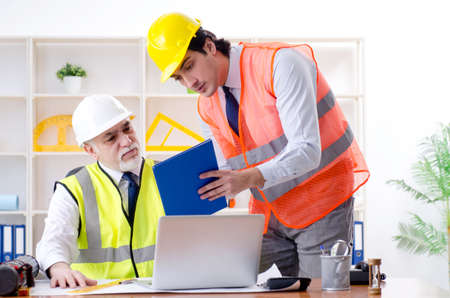 Two engineers colleagues working under project