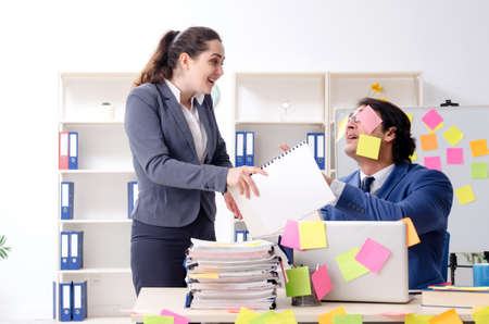 Two colleagues employees working in the officeの写真素材
