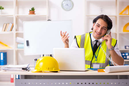 Male construction engineer working in the office