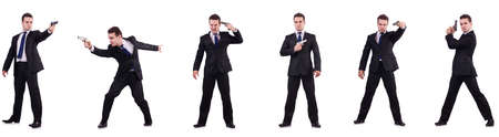 Man in suit with gun isolated on whiteの写真素材
