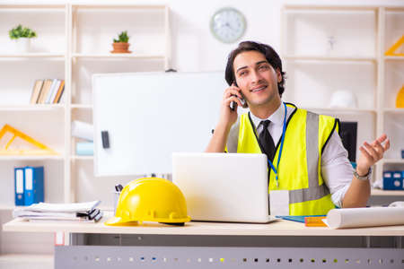 Male construction engineer working in the officeの写真素材