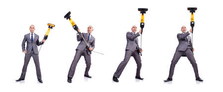 Businessman doing vacuum cleaning on white