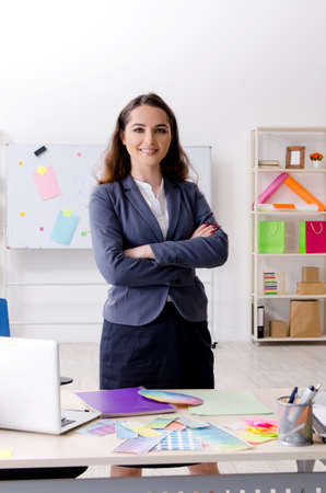 Young female designer working in the officeの写真素材