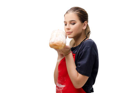 Young female baker isolated on whiteの写真素材