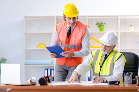 Two engineers colleagues working under project