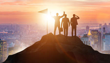 Businessmen in achievement and teamwork conceptの写真素材