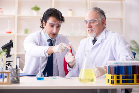 Two chemists working in the labの写真素材