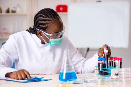Young black chemist working in the labの写真素材