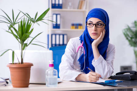 Arab female doctor working in the clinicの写真素材