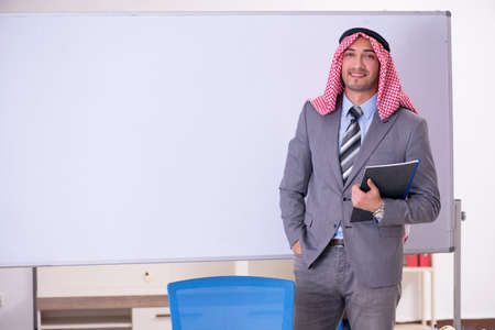 Young handsome arab teacher wearing suitの写真素材
