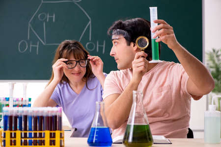 Two chemists students in classroomの写真素材