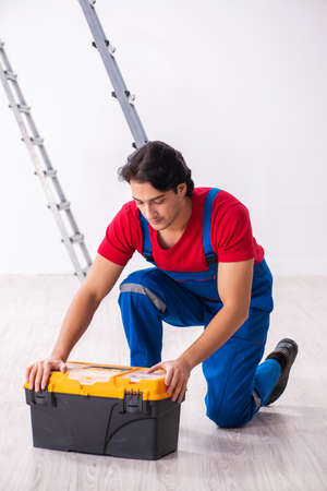 Young handsome contractor working indoorsの写真素材