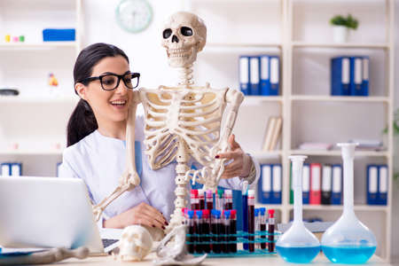 Young female archaeologist working in the lab