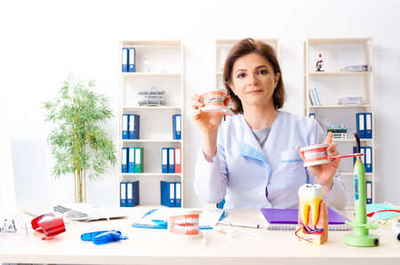 Female doctor working on new teeth implantの写真素材