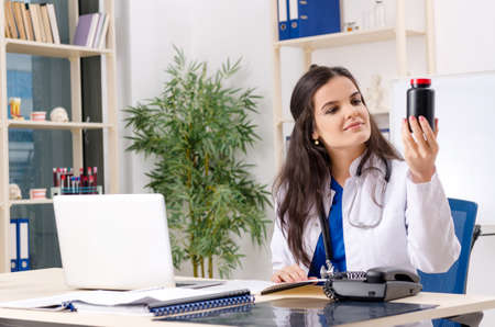 Female doctor working in the clinicの写真素材