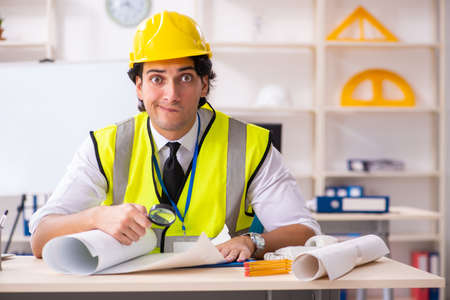 Male construction engineer working in the office