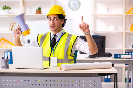 Male construction engineer working in the officeの写真素材