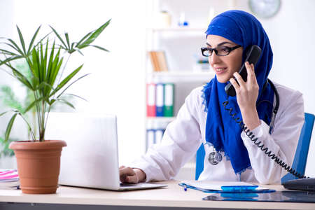 Arab female doctor working in the clinicの写真素材