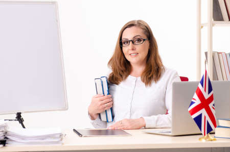 Female english teacher in the classroomの写真素材