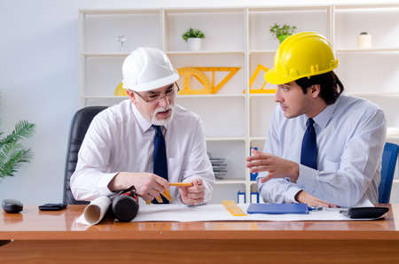 Two engineers colleagues working under project