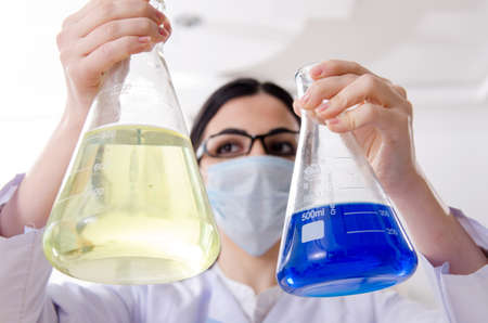 Young female chemist working in the lab
