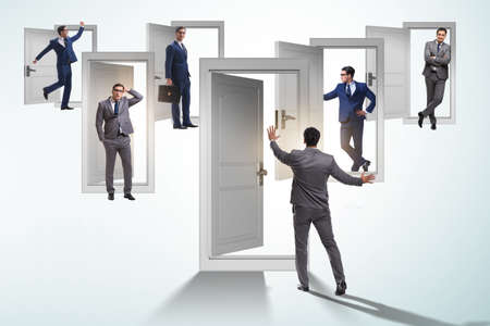 Businessman in uncertainty concept with many doors