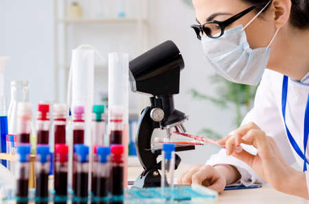 Young female chemist working in the labの写真素材