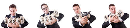 Businessman with money sacks and handgunの写真素材