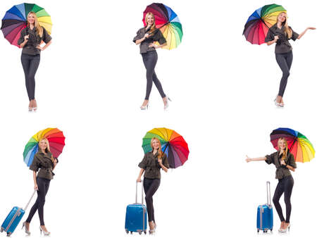 Woman with suitcase and umbrella isolated on whiteの写真素材