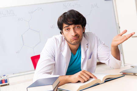 Young student chemist in the classroomの写真素材