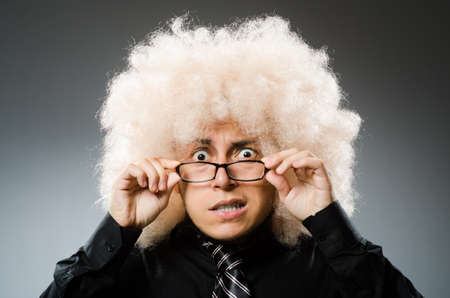 Young man wearing afro wigの写真素材