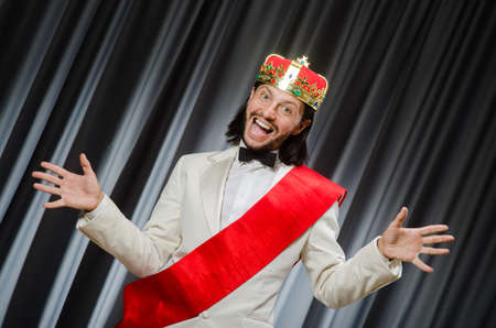 Funny king wearing crown in coronation concept