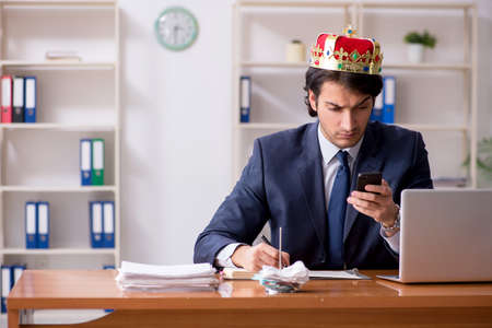 Young king businessman working in the officeの写真素材