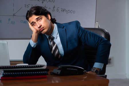 Financial specialist working late in the office