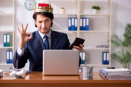 Young king businessman working in the officeの写真素材