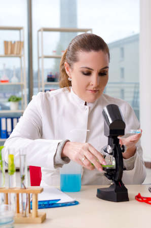 Female biotechnology scientist chemist working in the labの写真素材