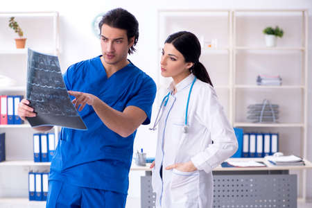 Two young doctors working in the clinic