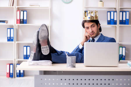 Young king businessman working in the officeの写真素材