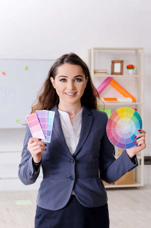 Young female designer working in the officeの写真素材