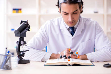 Young male scientist working in the lab