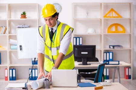 Male construction engineer working in the office