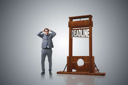 Businessman in deadline concept with guillotineの写真素材