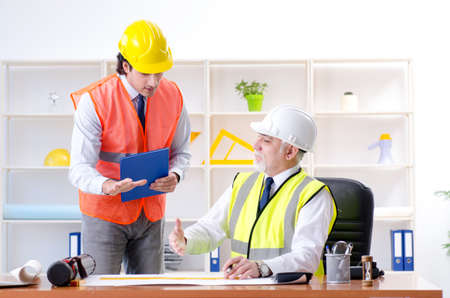 Two engineers colleagues working under project