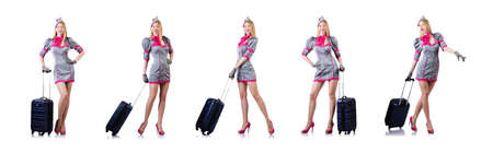 Airhostess with luggage on whiteの写真素材