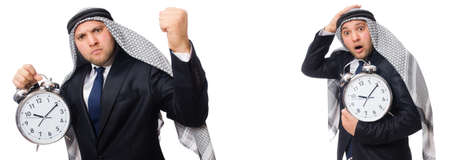 Arab businessman with alarm-clock in time management conceptの写真素材