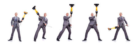 Businessman doing vacuum cleaning on whiteの写真素材
