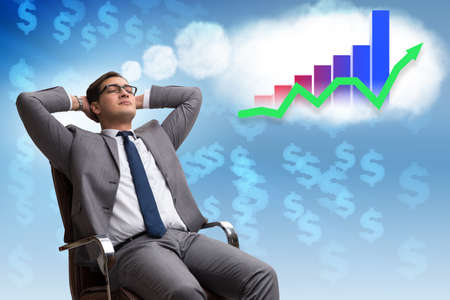 Businessman dreaming of stock market recoveryの写真素材