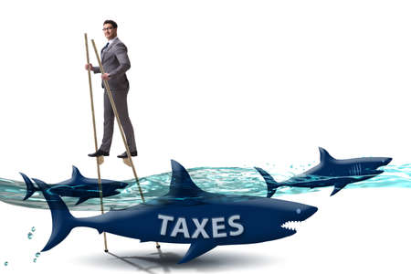 Businessman avoiding paying high taxesの写真素材
