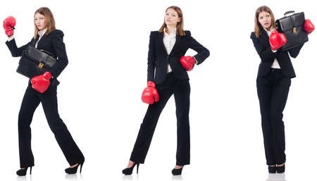 Businesswoman with boxing gloves isolated on whiteの写真素材