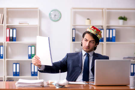 Young king businessman working in the officeの写真素材